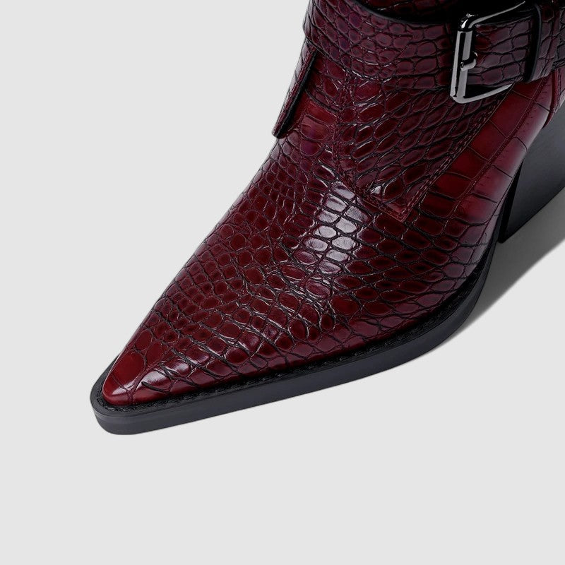 Close-up view showing pointed toe, embossed texture, and refined stitching