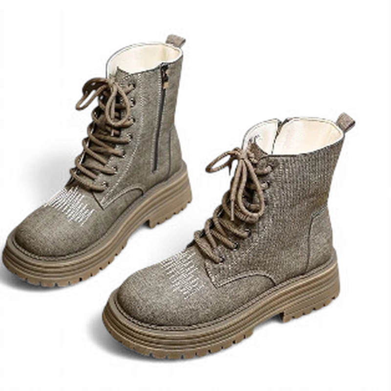 Taupe denim combat boots showing laces and side zipper on white backdrop.	