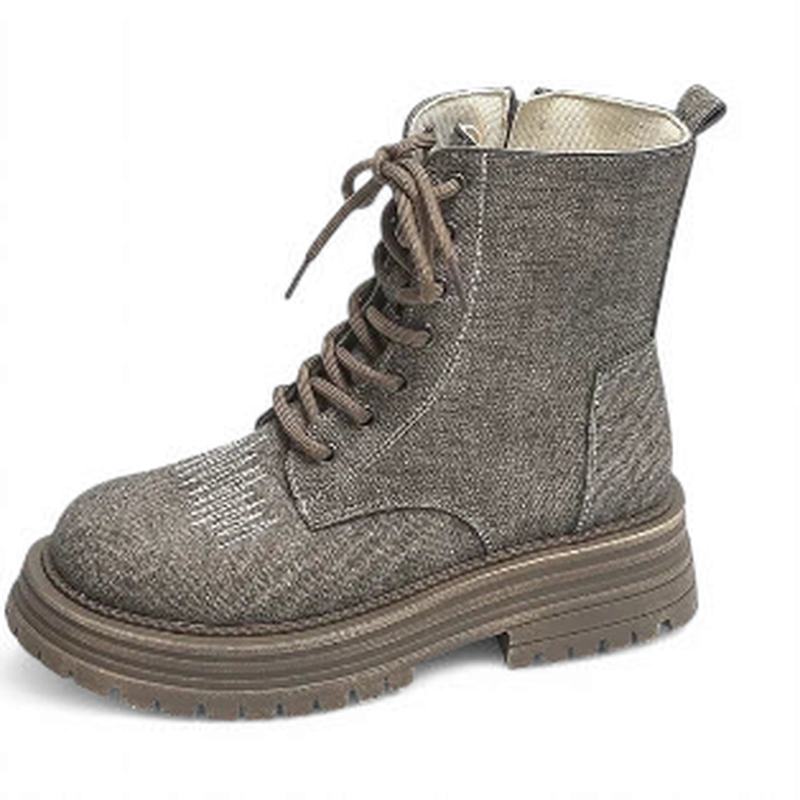 Single taupe boot upright; lacing, metal eyelets and layered sole visible.