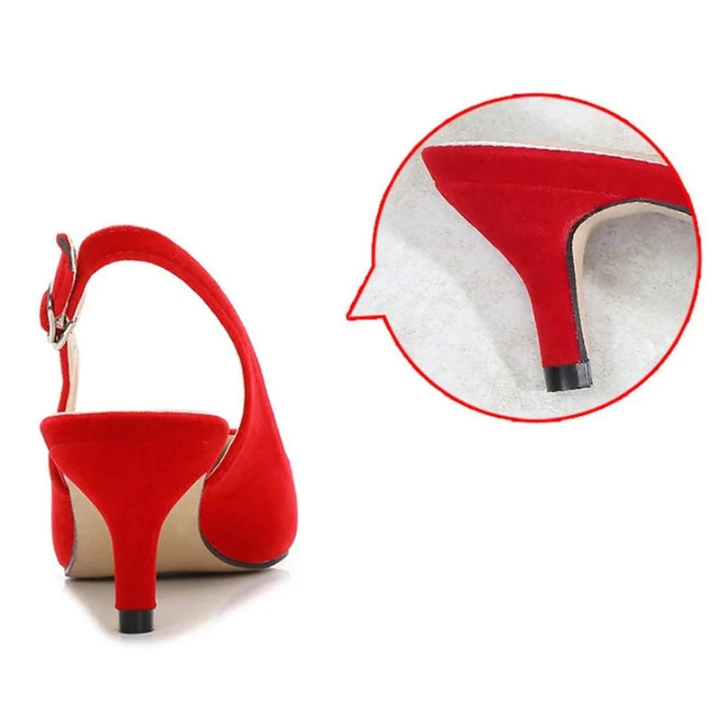 Close-up of red kitten heel and metal buckle detail, rear angle
