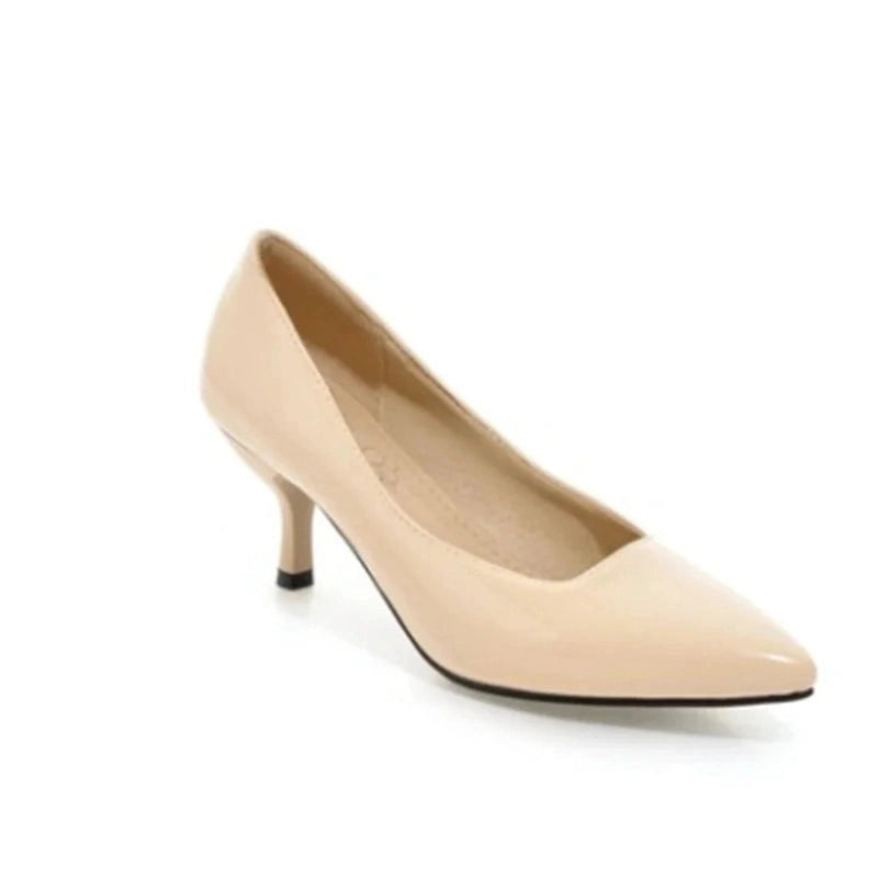 Glossy beige kitten-heel pump with pointed toe, clear side view.
