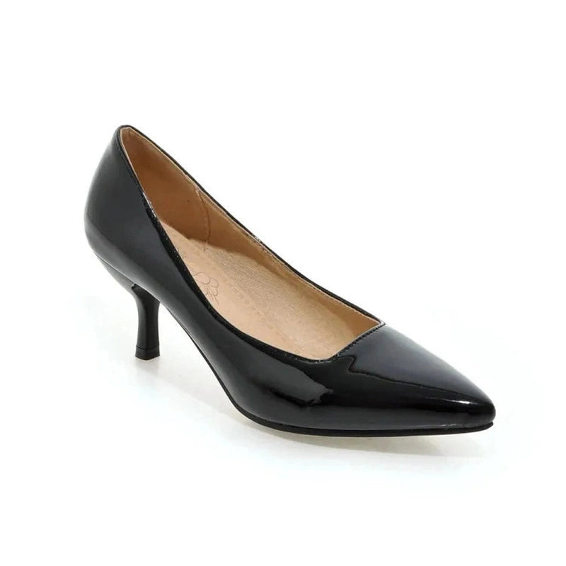 side view of glossy black pointed-toe kitten-heel pump.







