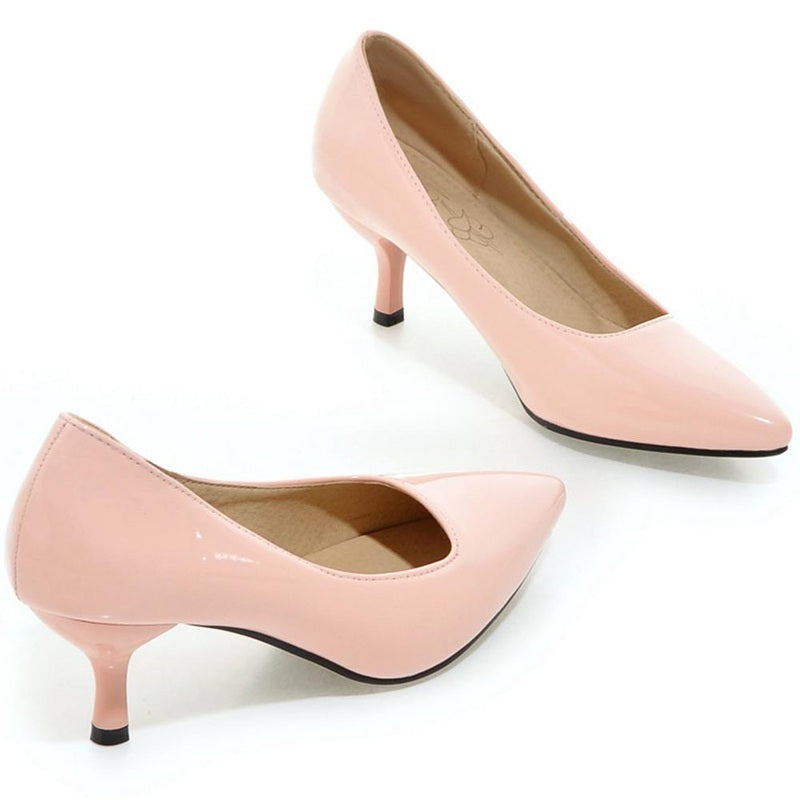Side pair view of glossy pale-pink pointed-toe kitten heels.
