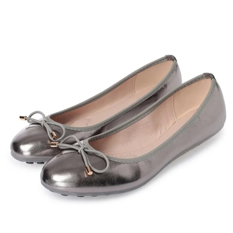 Dark-silver ballet flat with bow-knot and round toe, angled front view.