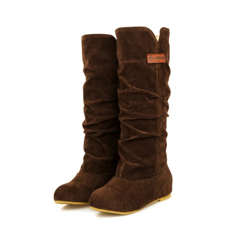 Pair of dark brown boots with smooth suede texture