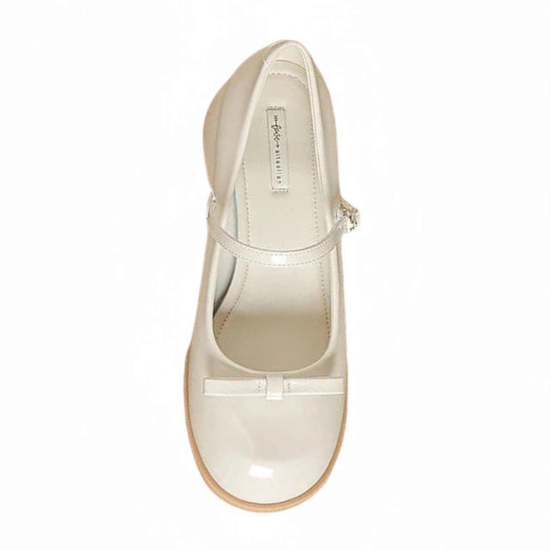 Top view of single glossy beige Mary-Jane showing lining and strap.