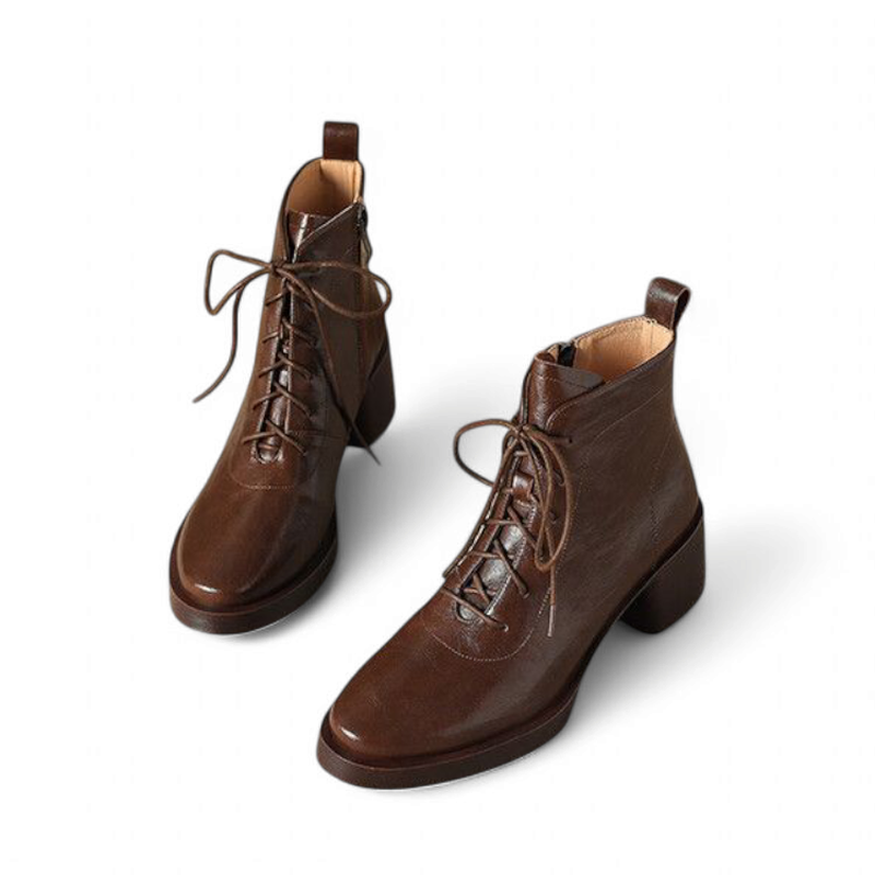 Front view of Merendy Tarek Victorian boots in brown split leather, featuring lace-up closure and detailed stitching.