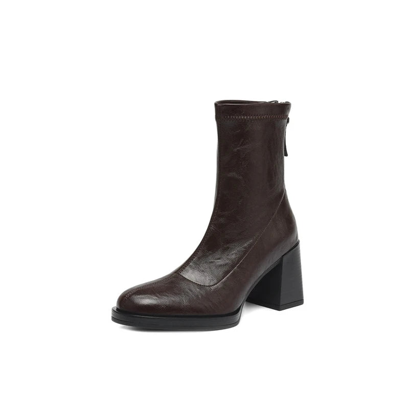 Brown leather mid-calf boot with back zipper and block heel in minimalist design
