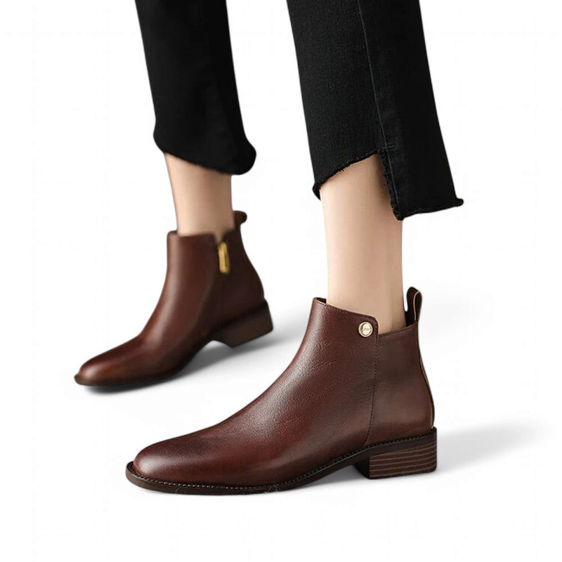  Pair of brown boots worn and shown from the front