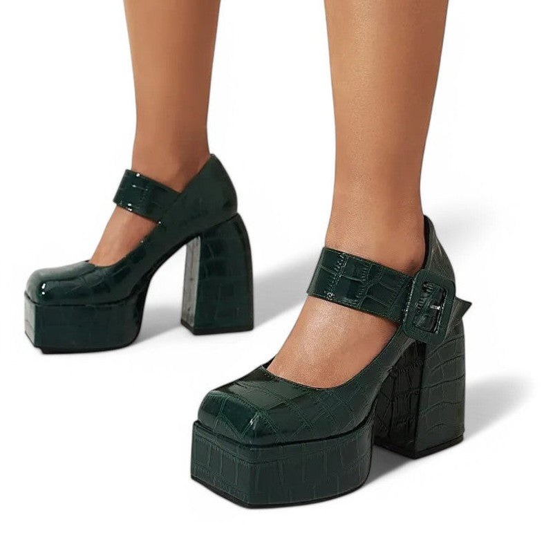 Side pose of green square‑toe platforms on both feet