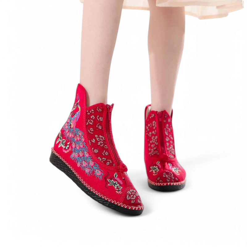 Front view of red pair with embroidery, zipper closed and knot detail at toe.
