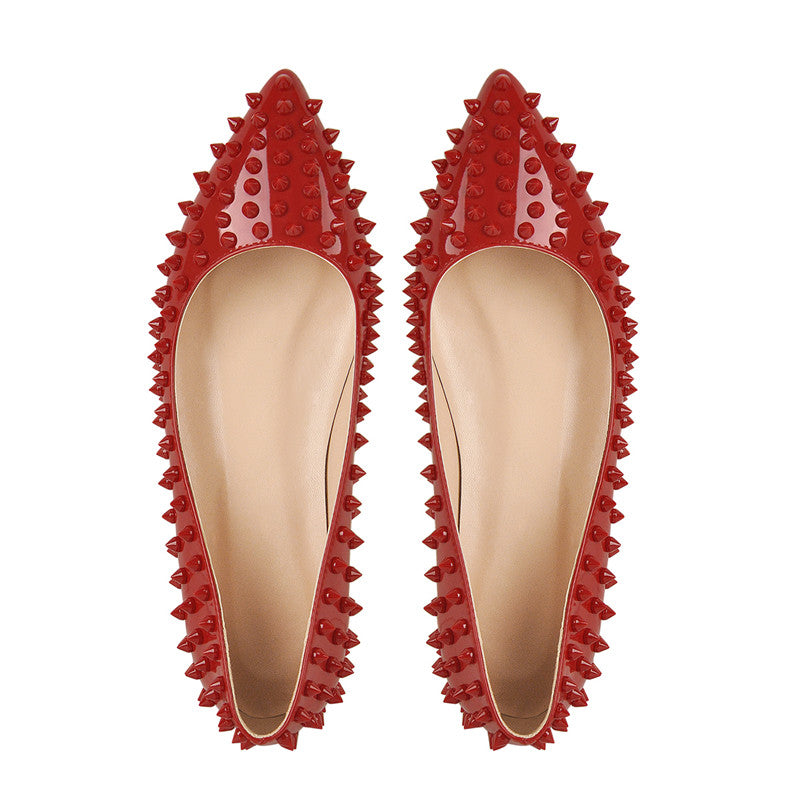 Top view of red pair highlighting pointed fronts and studded edges.