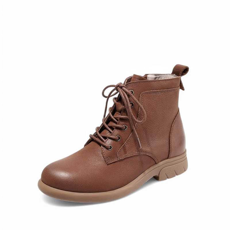 Left side view of a brown leather boot showing sole and stitching.