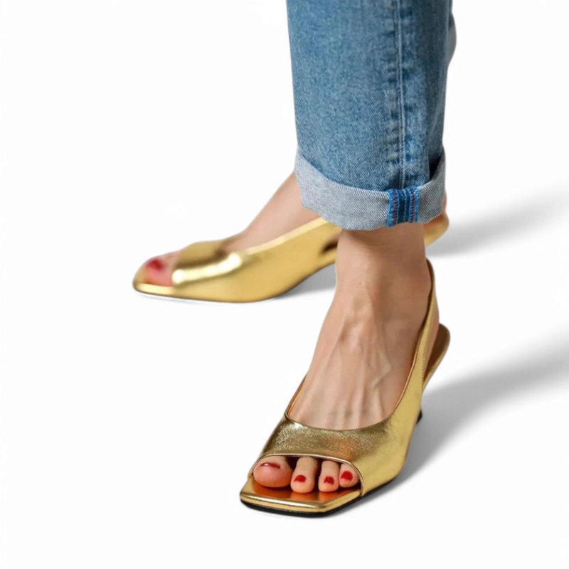 Low side shot highlighting gold sheen and slingback strap