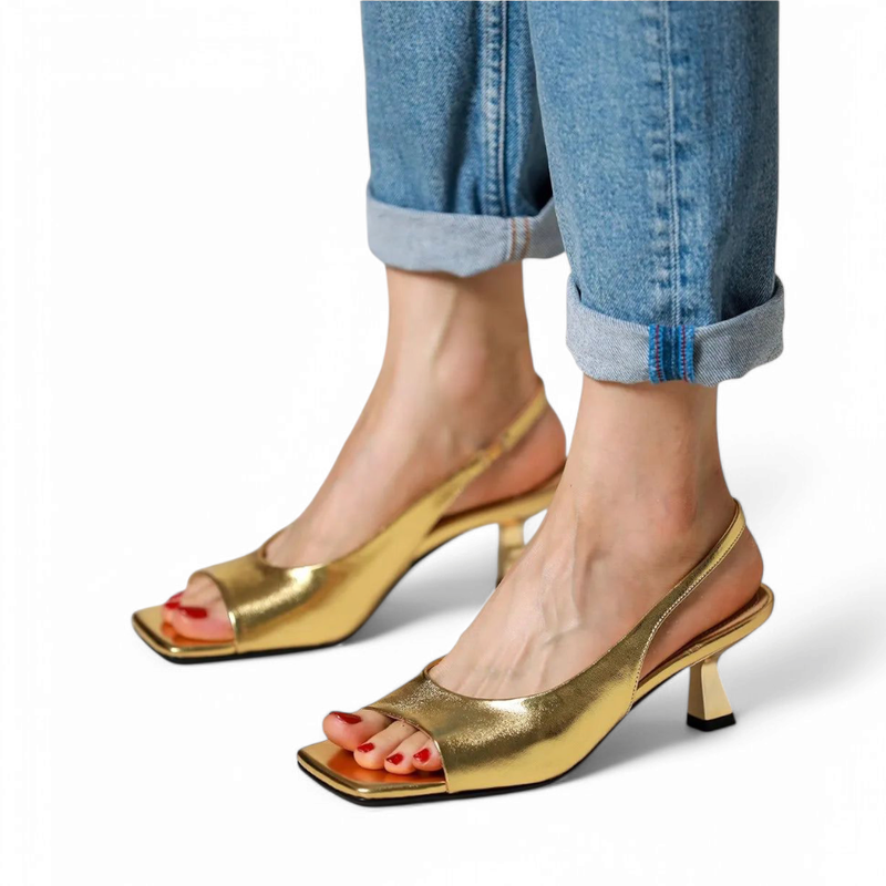 Twin view of gold kitten-heel pumps on walking model