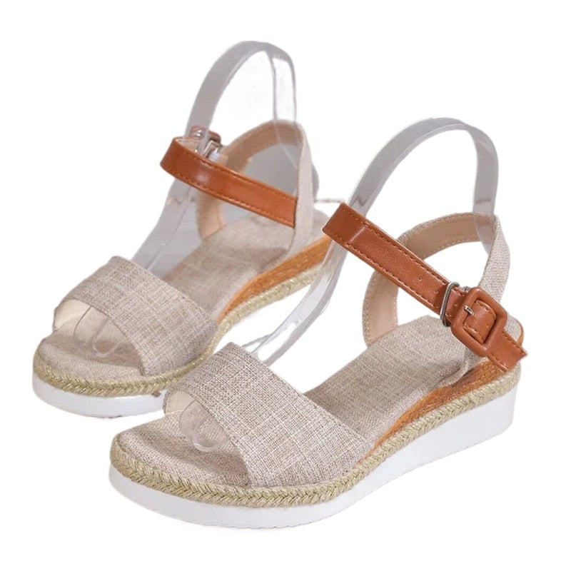 Angled pair of beige Lundiar wedges showing jute edge and white sole