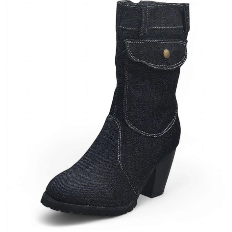 Black denim ankle boot showing contrast stitching, brass snap and rubber sole.	