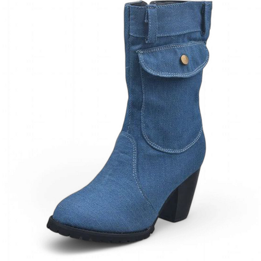 Medium-wash denim boot displaying curved panel seams and side pocket flap.