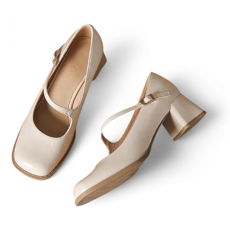 Alternate flat-lay arrangement of glossy beige Mary-Jane pumps on white background.