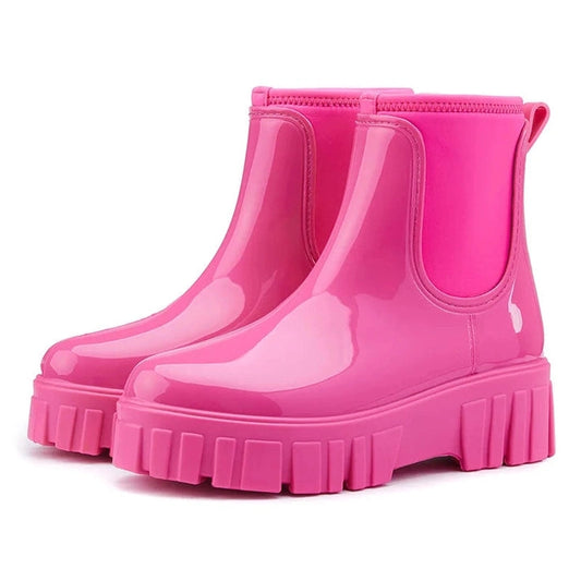 Rose Red glossy Chelsea boots viewed from a side anglee 