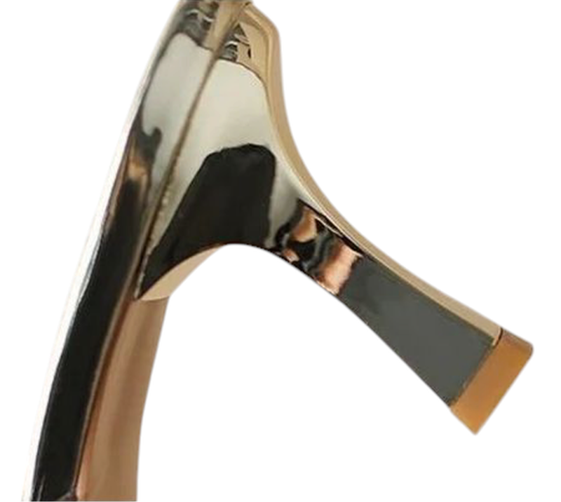 Detail of flared gold metal kitten heel with rubber tip.