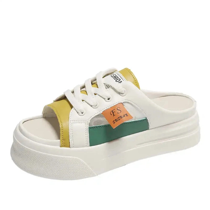 Static product shot of yellow-and-green color-block platform sandal with white laces, white background