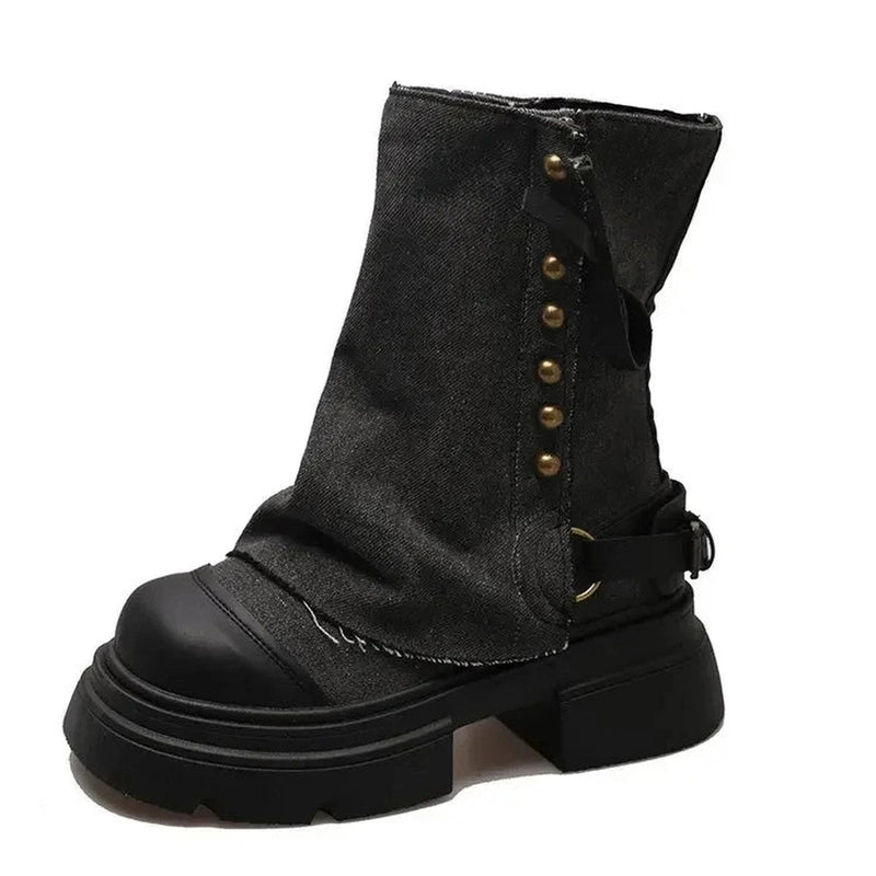 Single charcoal-denim boot with black block heel, lighting reveals fabric texture.