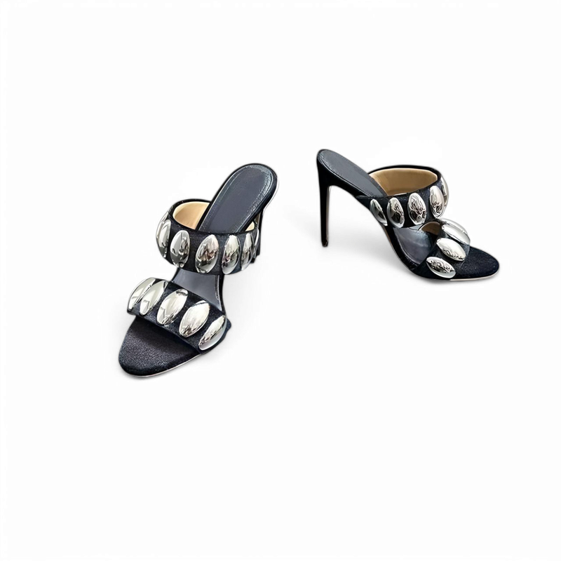 Flat-lay of the same mules, one front-facing, one angled.