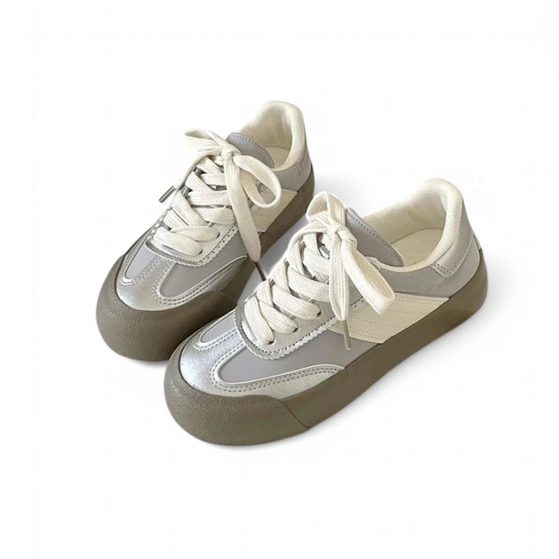 Silver-Gray sneaker pair, top view highlighting cream laces and khaki sole.

