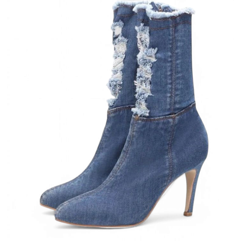 Light-blue denim boots with mid-high heel, front angle emphasising frayed detailing.