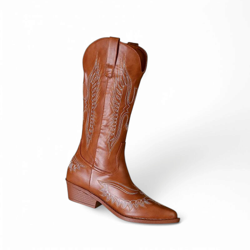 Brown western tall boot with decorative stitching, pull tabs, snip/almond toe, and low stacked heel; front-angled single on white