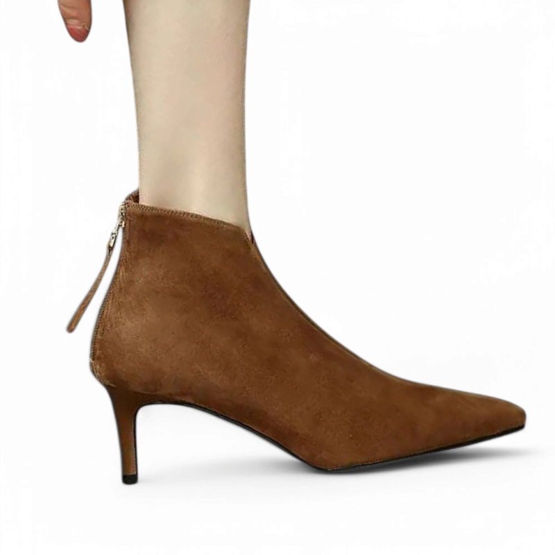 Brown suede boot with slim heel, full side view on foot.

