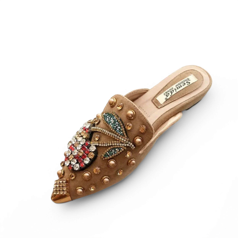 Camel pointed mule with crystal embellishment, angled top view on white background