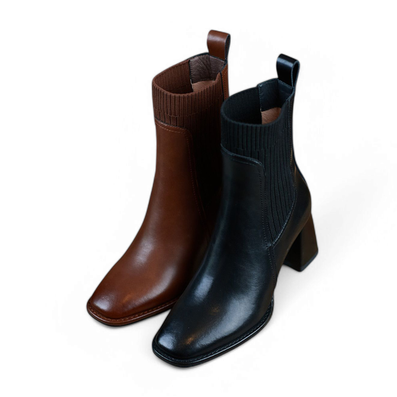 Front view of Merendy Elomda Chelsea boots displayed in both black and brown leather.
