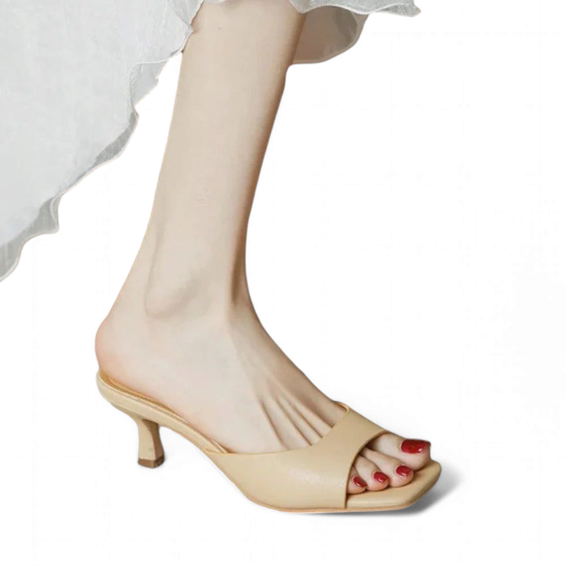 Indian Khaki open-toe kitten-heel sandal on model wearing light dress, white background