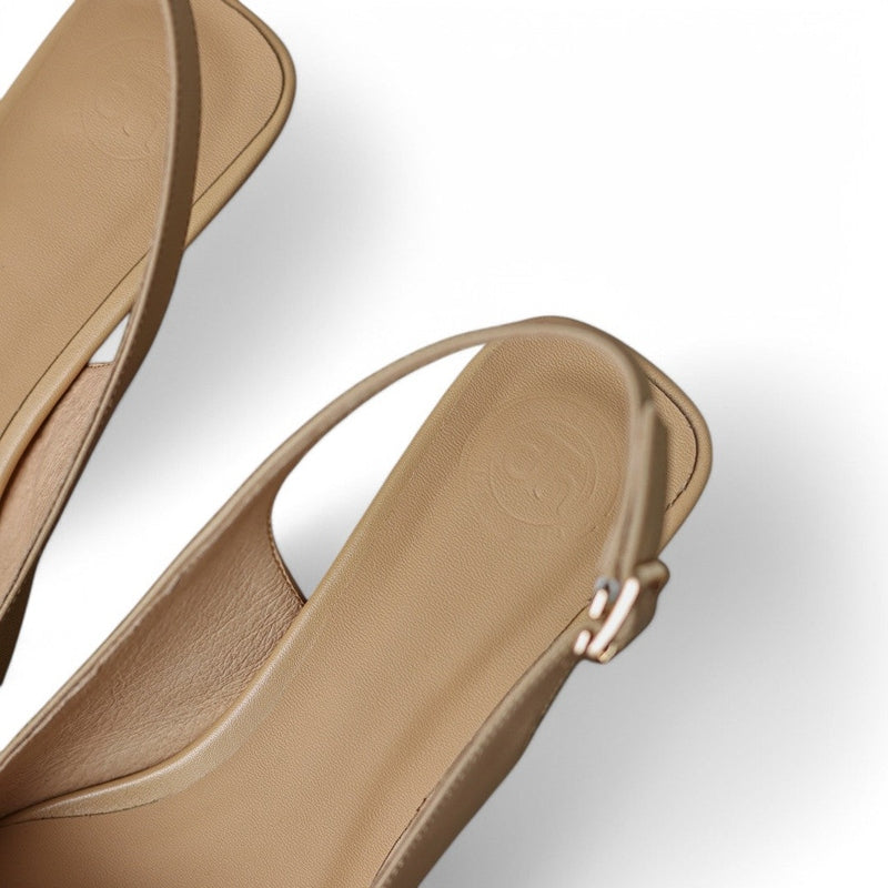 Top view showing leather slingback strap and adjustable metal buckle.

