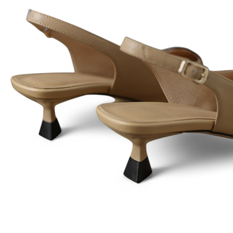 Detail of medium kitten heel in khaki with black rubber tip.

