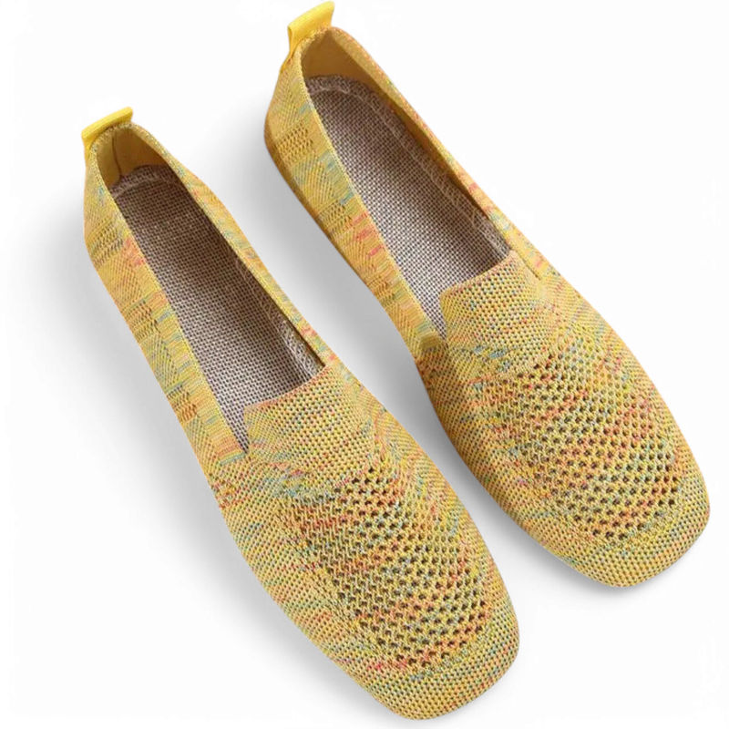 Top view of yellow multicolor knit loafers showing airy mesh pattern.