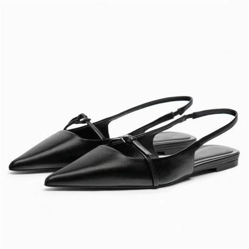 Black pointed slingback mules in right 3‑quarter view