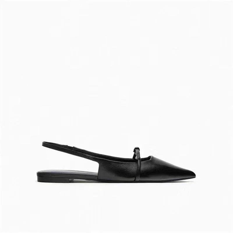 Single black pointed slingback mule with elastic back strap, side profile on white background