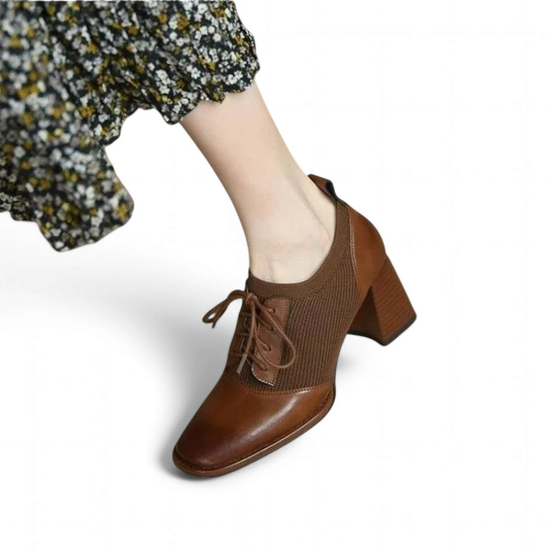 Brown leather ankle shoe with knit panel and block heel; on-foot three-quarter angle.