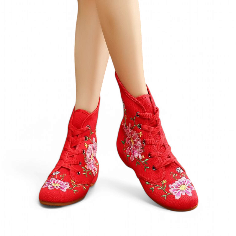 Front view of red pair with full lacing and prominent pink blossoms.
