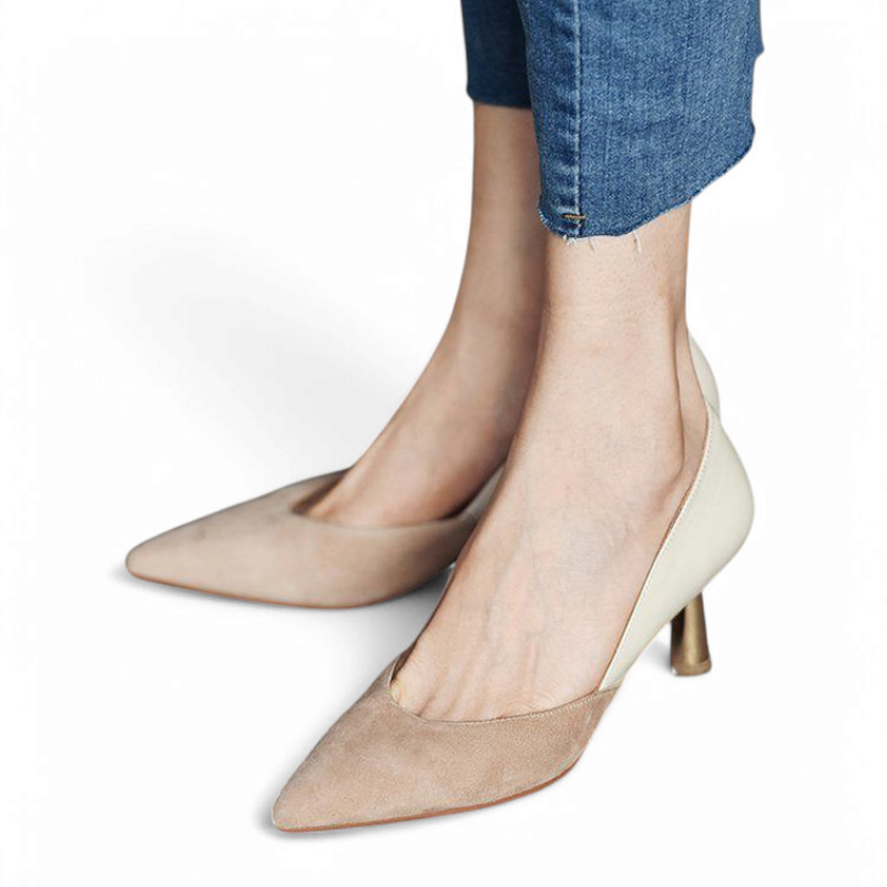 Front‑angled view of khaki‑and‑cream kitten‑heel pump on model’s foot