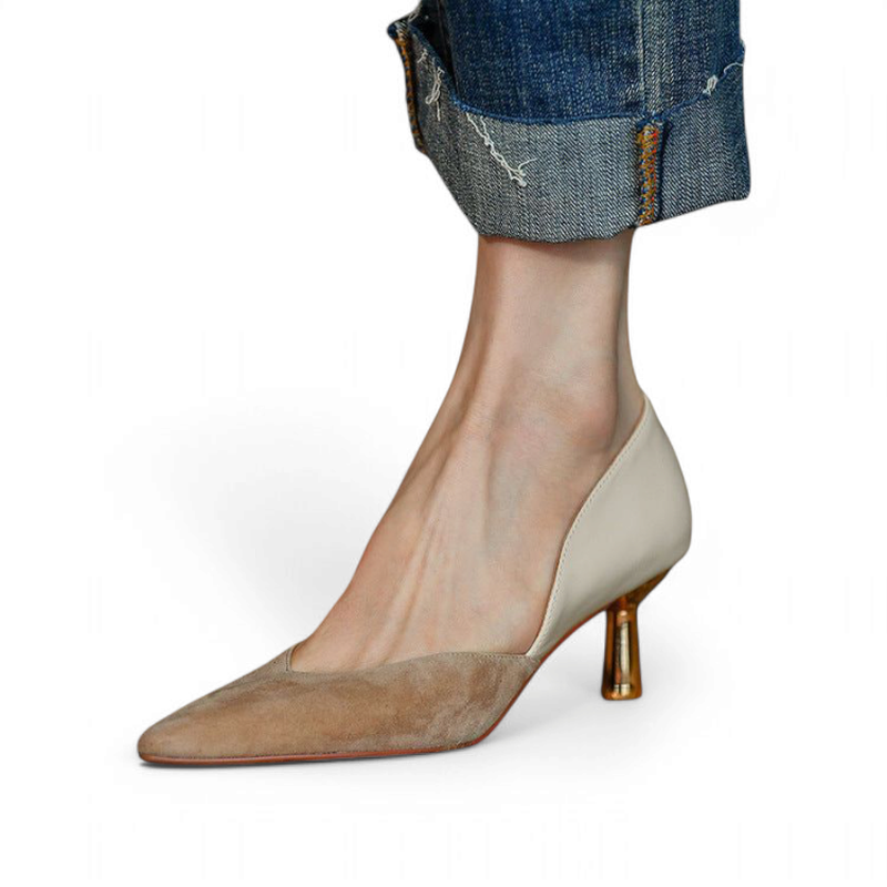 Pump shown with rolled‑hem denim, highlighting pointed suede toe