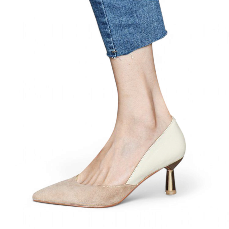 Side view of color‑block pump with gold kitten heel under cropped jeans	