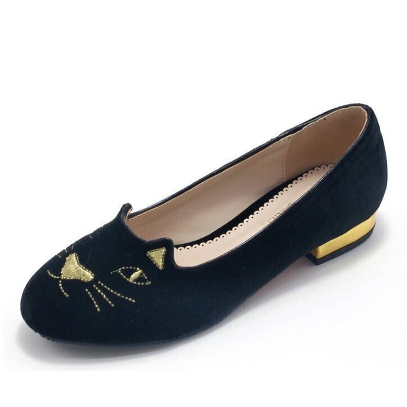 Three-quarter single shoe view highlighting the round toe and gold-plated low heel.
