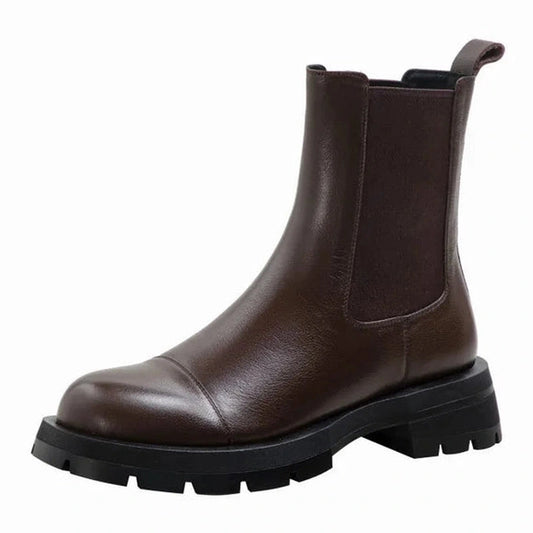 Studio shot of brown Chelsea boot with chunky rubber sole