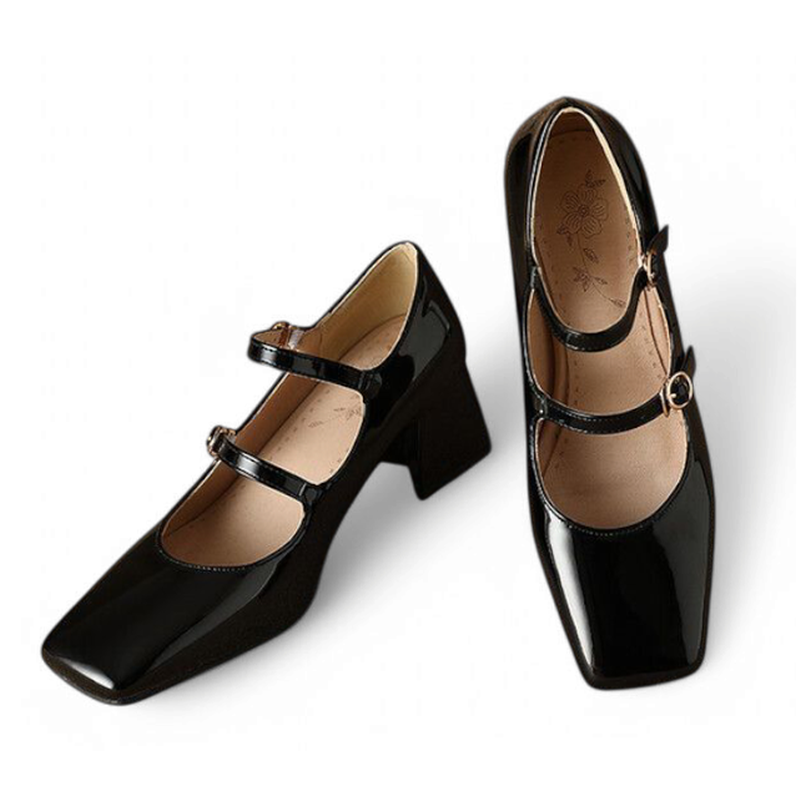 Glossy black pair angled forward showing double buckles and block heel