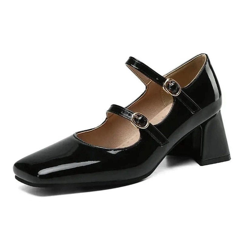 Single black shoe on white background highlighting reflective surface and broad heel