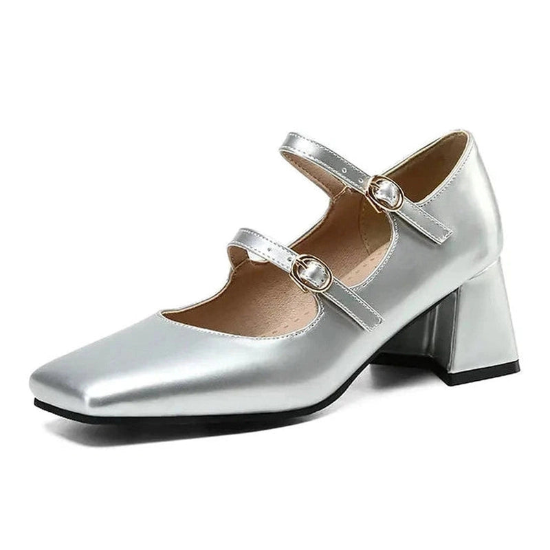 Single silver shoe on white background showing etched insole